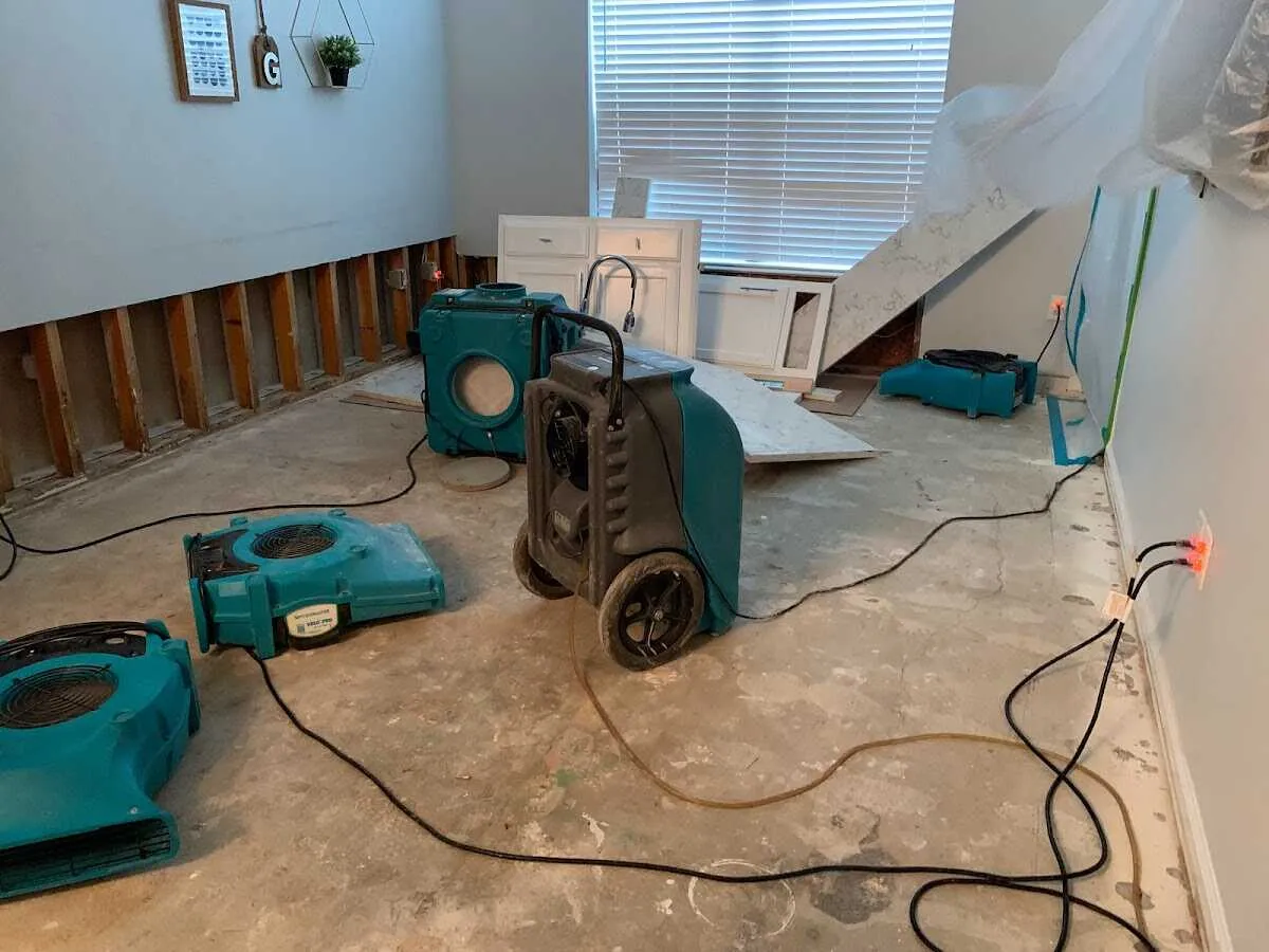 Dehumidifier in flood-cut room for Water Damage Restoration in Dinuba